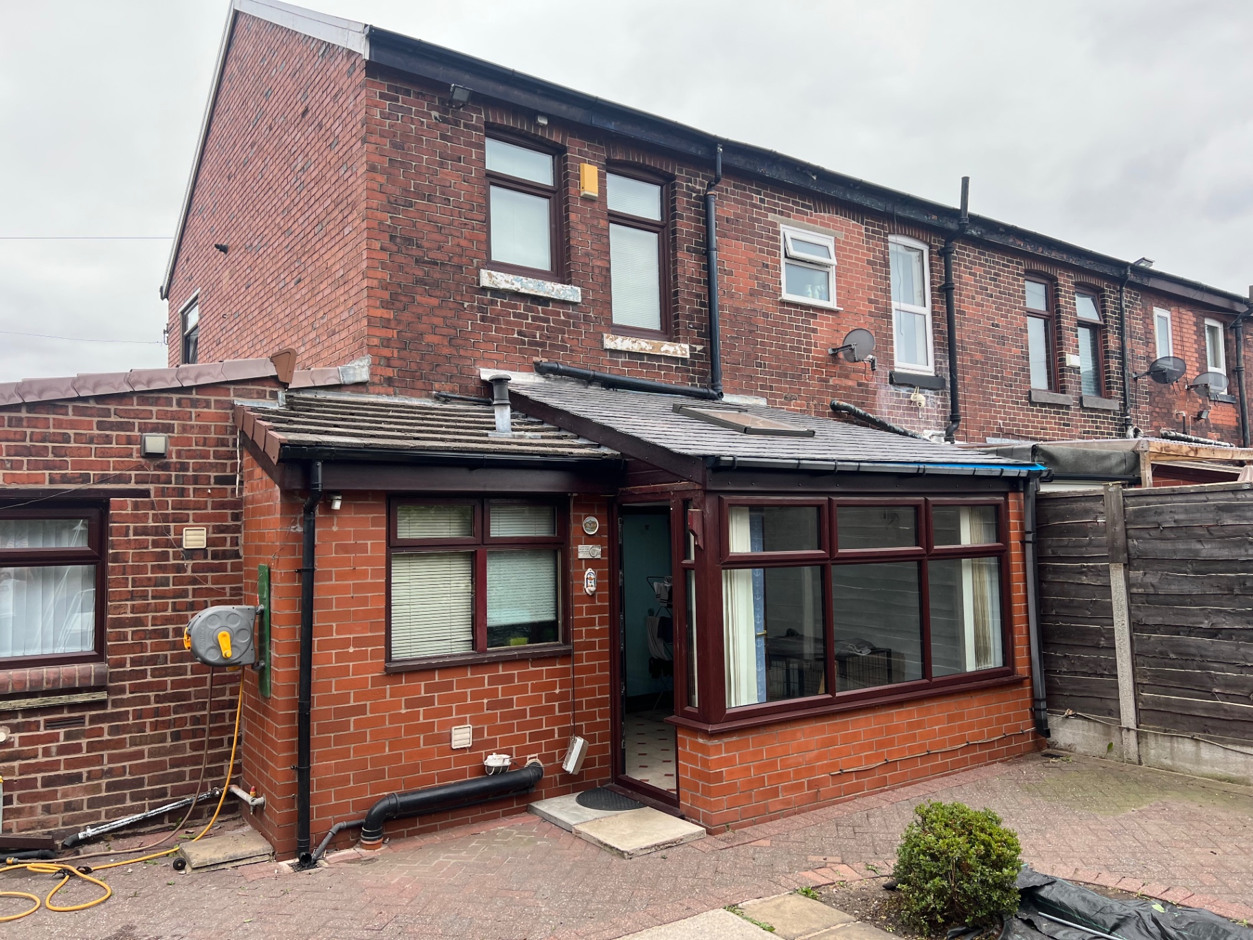 Completed rear elevation showing new tiled roof, skylight and rainwater system